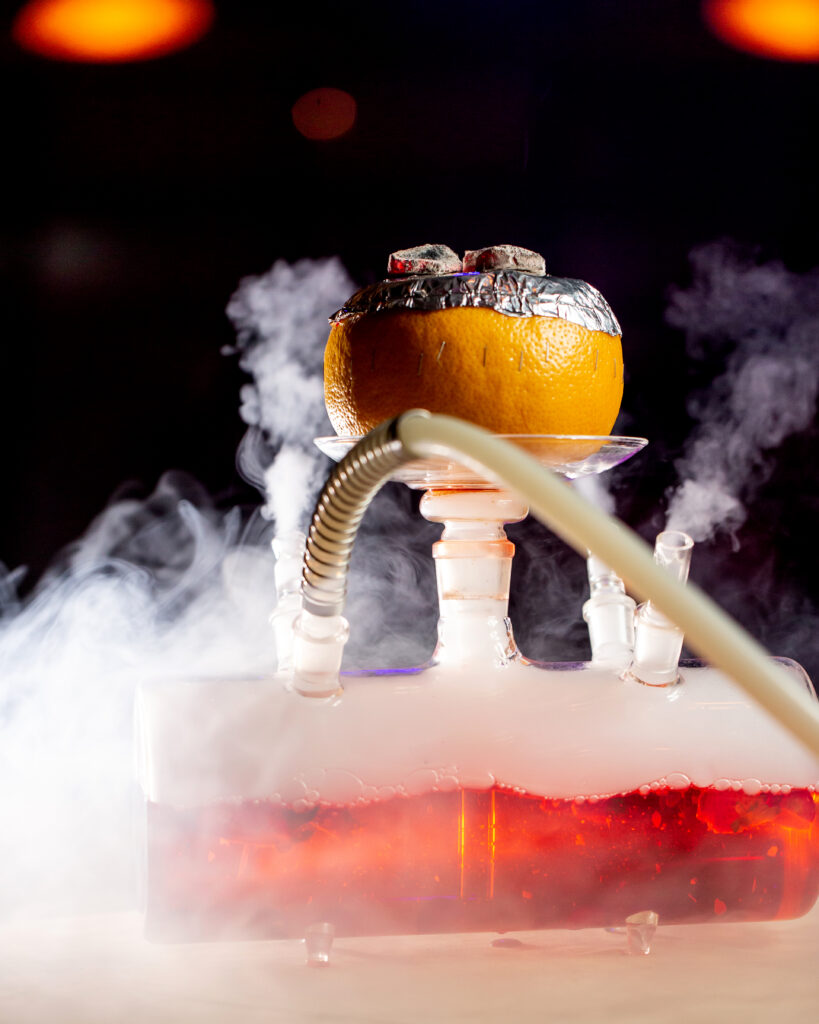 smoke coming out from grapefruit hookah glass base